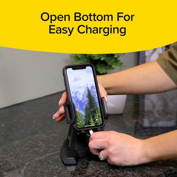 Desk Call with smartphone in it and a woman is plugging in a phone charger. Headline says Open Bottom For Easy Charging