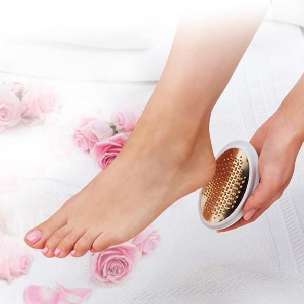 Woman using PedEgg Easy Curve Foot File on her heel