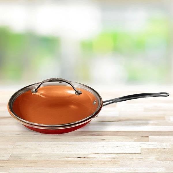 Red Copper Round Lid on pan sitting on countertop