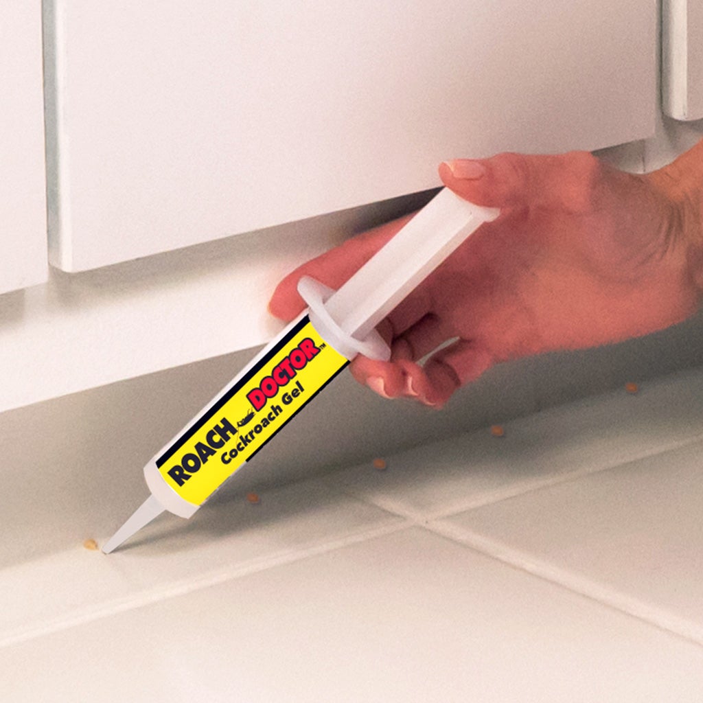 Applying Roach Doctor under cabinets