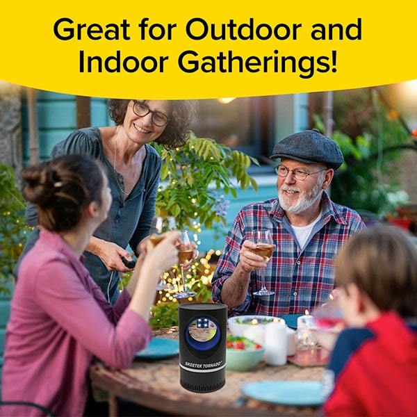 Family gathered around a table outside eating with a Skeeter Tornado on the table. Text says "Great for Outdoor and Indoor Gatherings!"