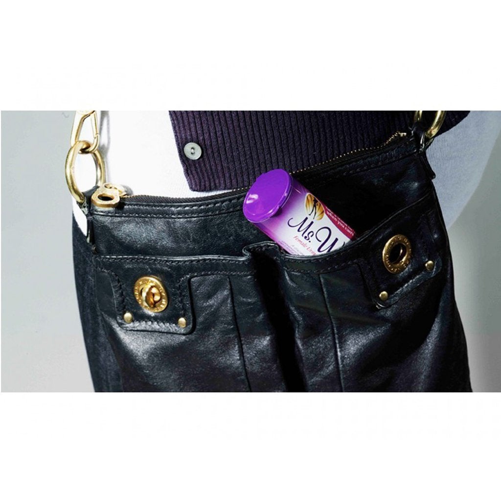 Ms. Whiz in its packaging in a purse pocket