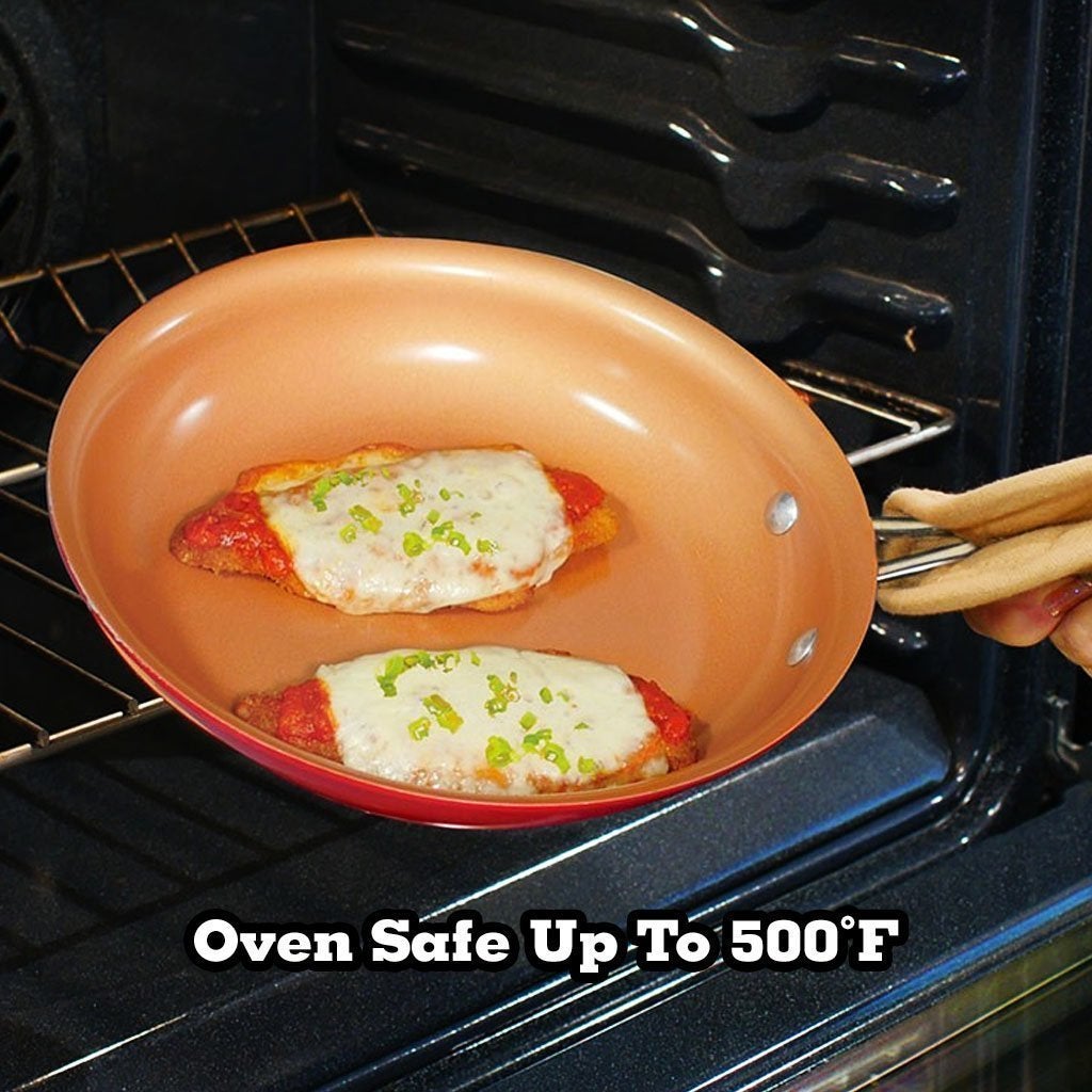 Red Copper Pan being placed into oven with food in it to cook. Text says Oven Safe Up To Five Hundred Degrees Fahrenheit