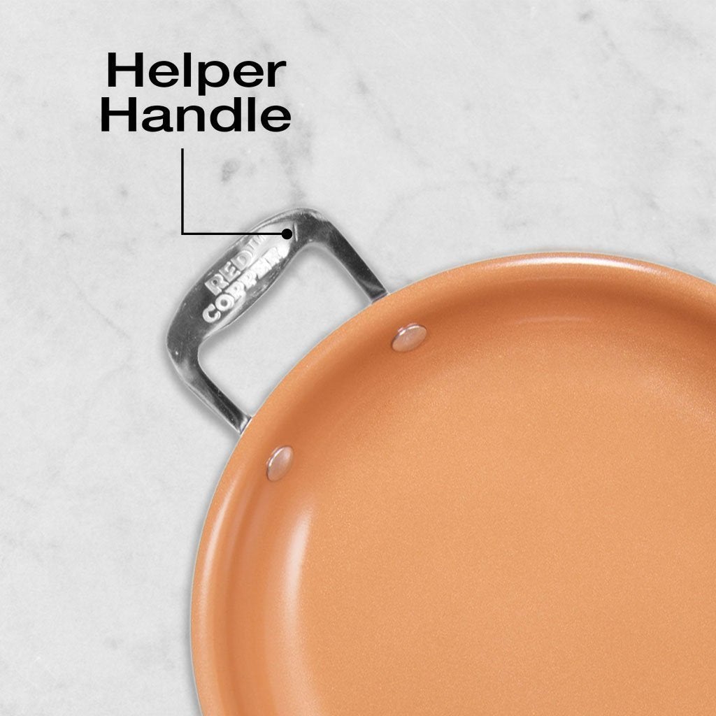 Close up of Red Copper Pan handle, text says Helper Handle